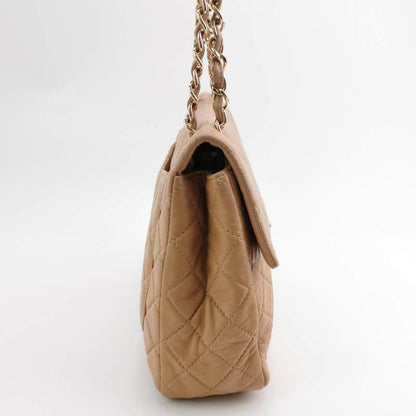 Chanel Classic Flap Maxi Beige Latte Lambskin Leather Giant Gold-tone CC Logo