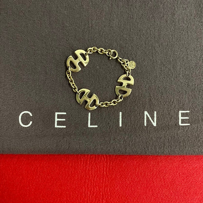 CELINE bracelet Gold Plated gold logo motif Women