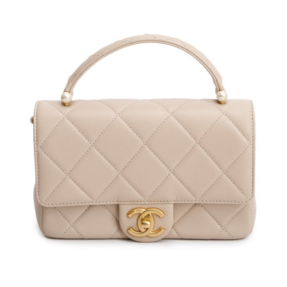Chanel 2025 Beige Quilted Lambskin Top Handle Flap Pearl Purse