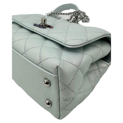 CHANEL Coco Extra Mini Top Handle Iridescent Caviar Leather Crossbody Bag Light Blue