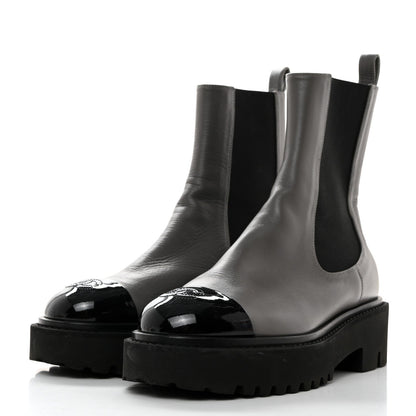 CHANEL CC CRUMPLED CALFSKIN PATENT CAP TOE CHELSEA BOOTS