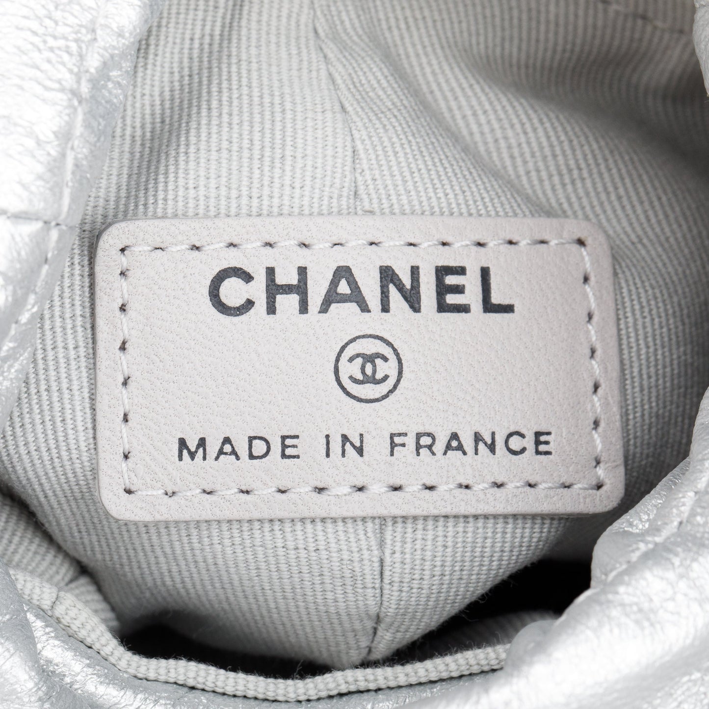 Chanel 2023 Metallic Silver Calfskin Leather Micro Drawstring Bucket Bag