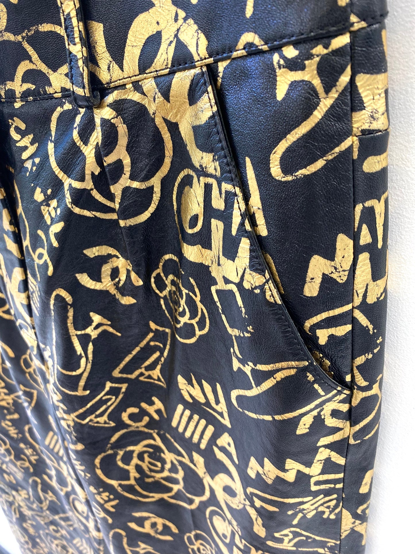 CHANEL CC ALLOVER LOGO LEATHER TROUSERS