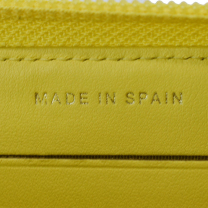 CHANEL Boy Caviar Quilted Zip Around Wallet Yellow