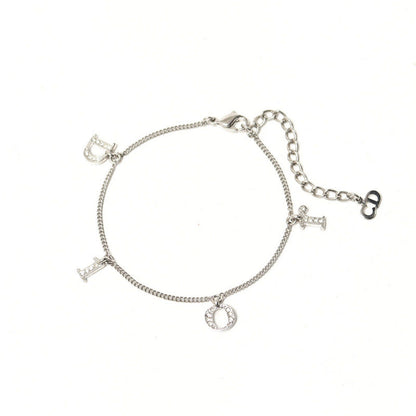 Christian Dior bracelet Gold Plated, Crystal Stone Silver Logo charm Women