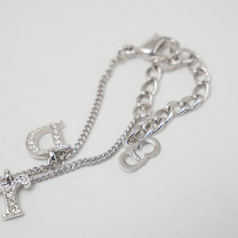 Christian Dior bracelet Gold Plated, Crystal Stone Silver Logo charm Women