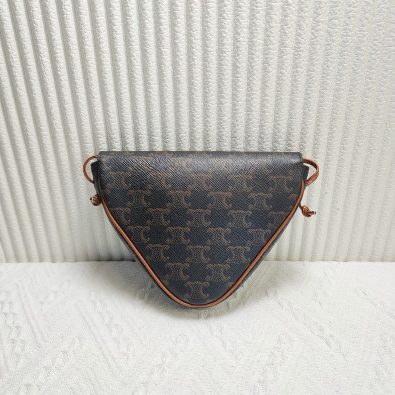 Luxury CELINE Triomphe Clutch in Brown Canvas