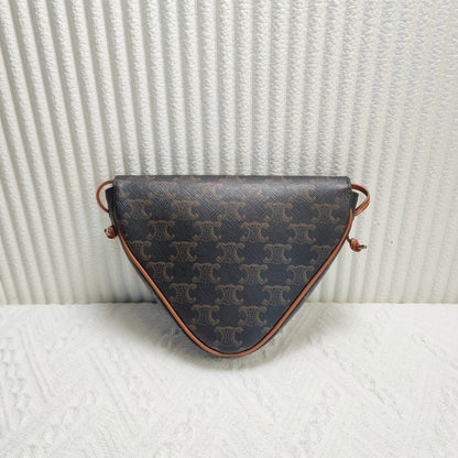 Luxury CELINE Triomphe Clutch in Brown Canvas