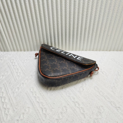 Luxury CELINE Triomphe Clutch in Brown Canvas